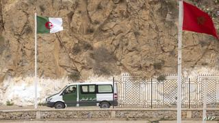 A picture taken from the Moroccan region of Oujda shows Algerian border guards patrolling along the border with Morocco on November 4, 2021. - Algeria has accused its arch-rival Morocco of killing three Algerians on a desert highway, as tensions escalate between the neighbours over the contested Western Sahara. (Photo by FADEL SENNA / AFP)