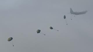 Romanian paratroopers jumps from an Hercules C130 aiplane during the "Platinum Eagle 15" military exercise at training facilities in Babadag, Romania on May 26, 2015. "Platinum Eagle 15" runs from May 11 to 28, 2015 involving some 150 US Marines and Sailors, 500 Romanian Forces and 30 Bulgarian Army personnel, all of them part of the Black Sea Rotational Force. AFP PHOTO DANIEL MIHAILESCU (Photo by DANIEL MIHAILESCU / AFP)