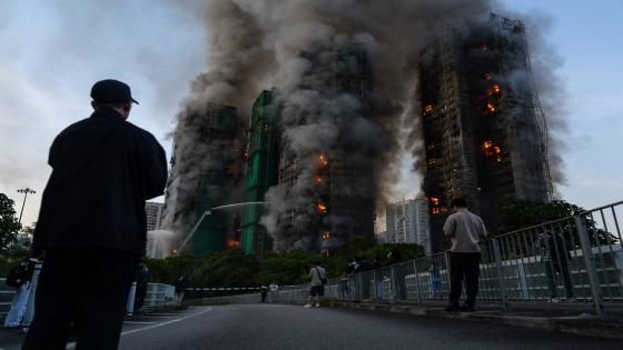 Smoke rises after a fire broke out at Wang Fuk Court, a residential estate in the Tai Po district of Hong Kong's New Territories on Wednesday, Nov. 26 2025. (AP Photo/Chan Long Hei)
