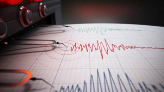 Seismograph printing seismic activity records of a severe earthquake.