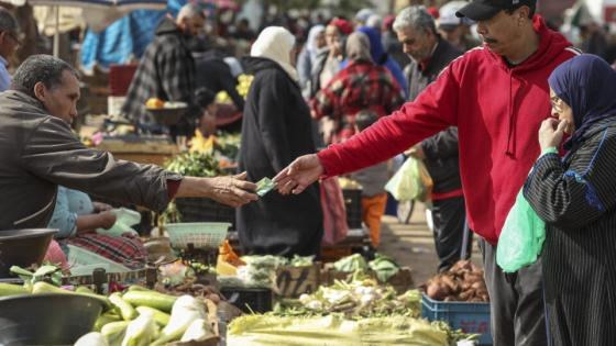 In this picture taken on February 23, 2023, shoppers buy fresh produce at the Sidi Moussa market in Morocco's Atlantic coastal city of Sale, north of the capital. Rising inflation in Morocco is driving up living costs and stirring public anger, and as food prices spike criticism is targeting the country's export-led agricultural model. (Photo by FADEL SENNA / AFP)