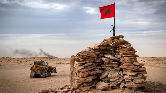 A bulldozer passes by a hilltop manned by Moroccan soldiers on a road between Morocco and Mauritania in Guerguerat located in the Western Sahara, on November 23, 2020, after the intervention of the royal Moroccan armed forces in the area. - Morocco in early November accused the Polisario Front of blocking the key highway for trade with the rest of Africa, and launched a military operation to reopen it. (Photo by Fadel SENNA / AFP) (Photo by FADEL SENNA/AFP via Getty Images)